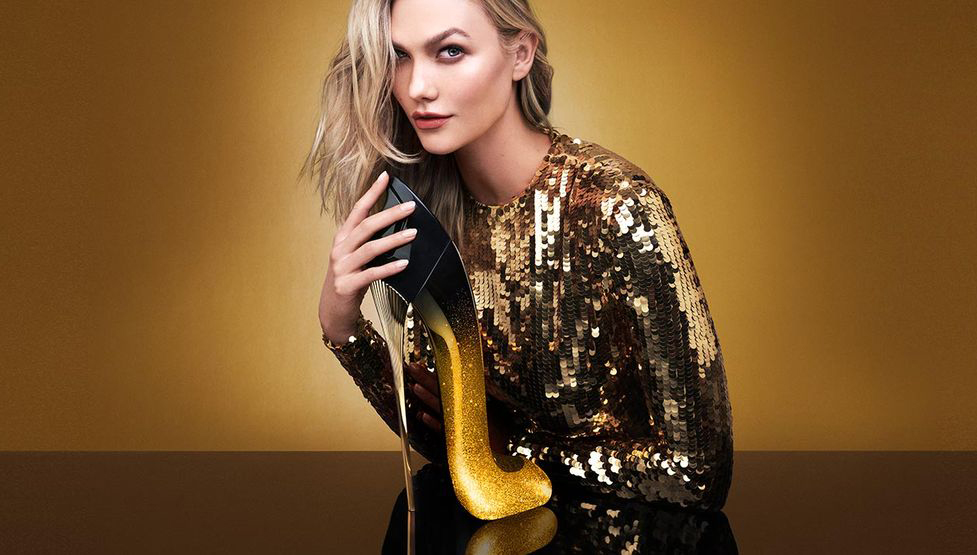 STUDIO BAKUZA CAROLINA HERRERA GOOD GIRL MIDNIGHT KARLIE KLOSS IN GOLD DRESS